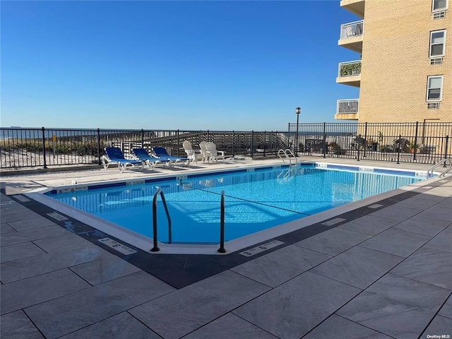 view of pool featuring a patio area