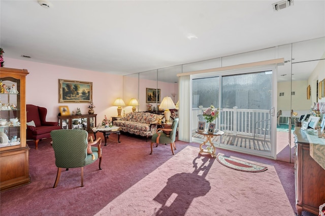 living area with carpet and visible vents