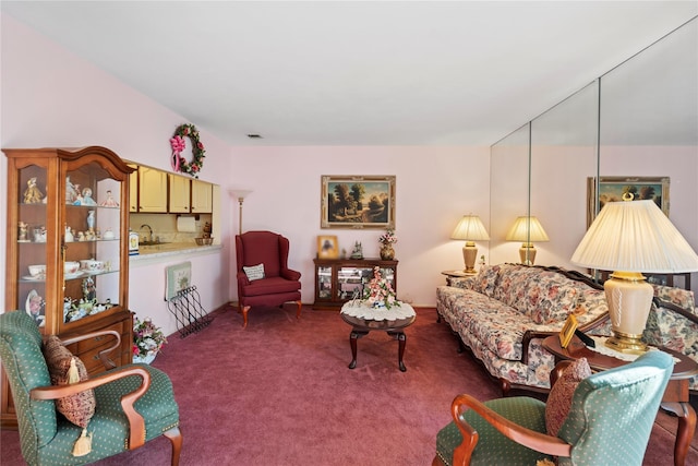 carpeted living area featuring visible vents