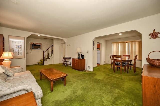 living room with carpet flooring and a wall mounted AC