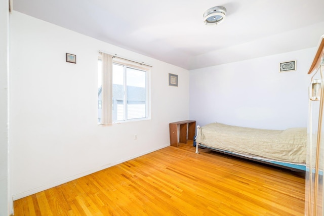 unfurnished bedroom featuring hardwood / wood-style flooring