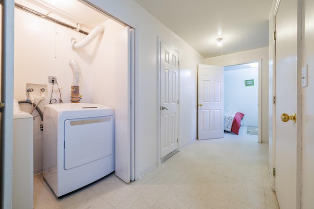 laundry area with separate washer and dryer