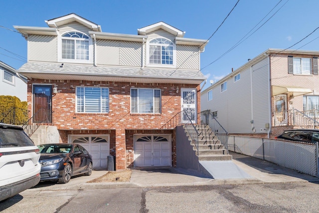 multi unit property featuring a garage