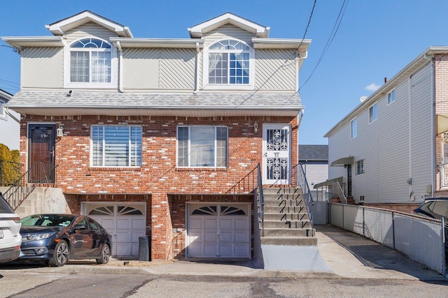 multi unit property featuring a garage