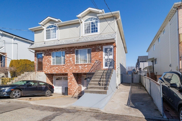 multi unit property featuring a garage