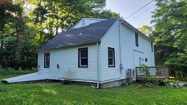 4030 Old Rte 22, Brewster, NY 10509 - view of side of home with a lawn, a wooden deck, and a shingled roof