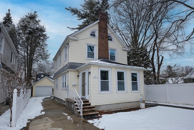 view of front facade with a garage and an outdoor structure