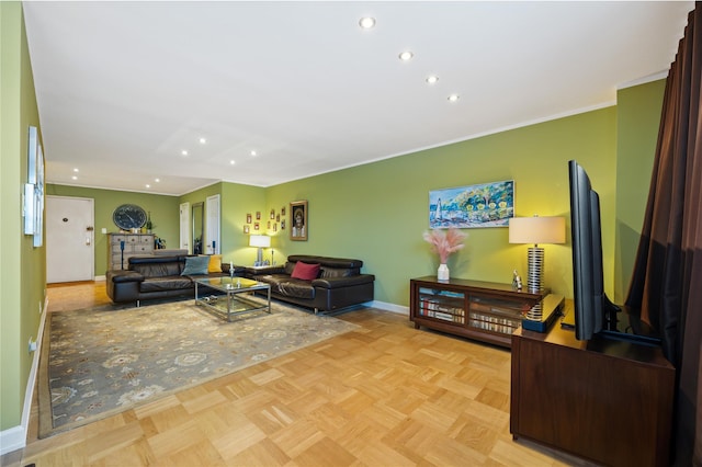 living room with ornamental molding and light parquet floors