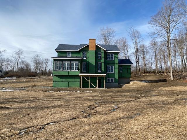 rear view of property with a sunroom