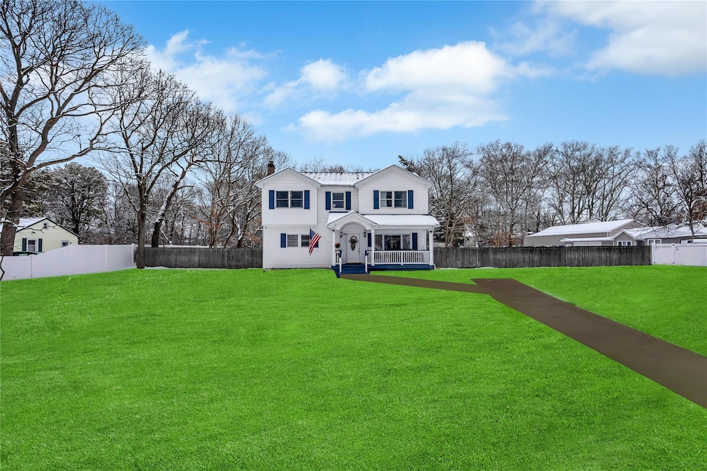rear view of house with a lawn