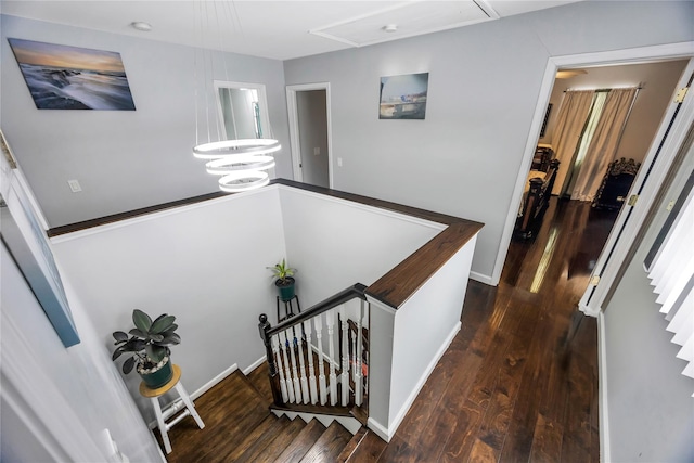 corridor with dark hardwood / wood-style floors