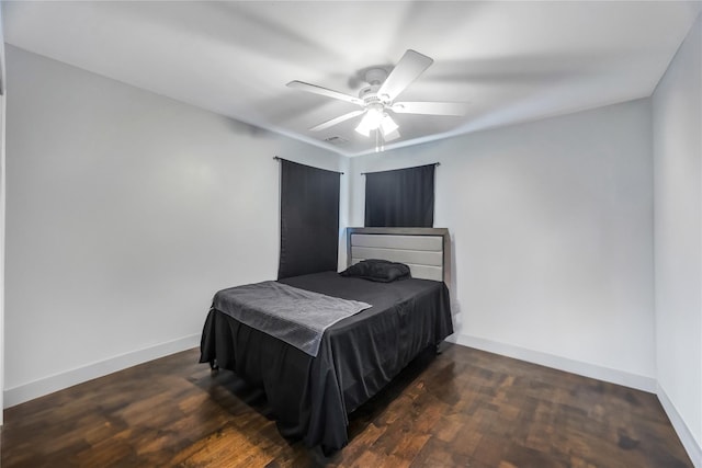 bedroom featuring ceiling fan and dark hardwood / wood-style floors