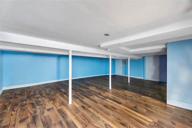 basement featuring dark hardwood / wood-style floors