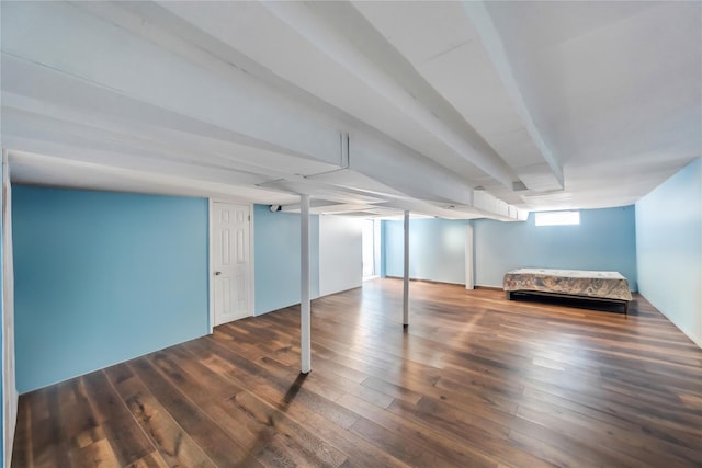 basement with dark wood-type flooring