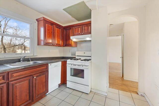 313 Sixth Ave, Pelham, NY 10803 - kitchen with light tile patterned flooring, white appliances, and sink