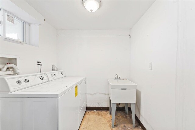 313 Sixth Ave, Pelham, NY 10803 - laundry room featuring washing machine and dryer and light tile patterned floors