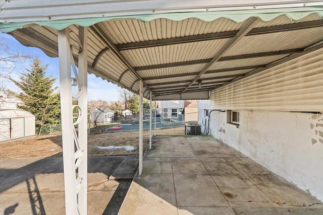 313 Sixth Ave, Pelham, NY 10803 - view of patio / terrace with central AC unit and a shed