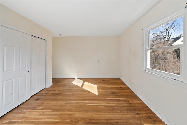 313 Sixth Ave, Pelham, NY 10803 - unfurnished bedroom with a closet and light hardwood / wood-style flooring