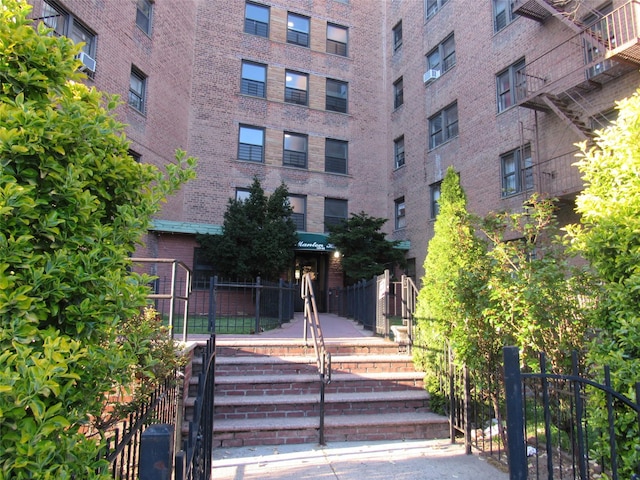 view of property with fence