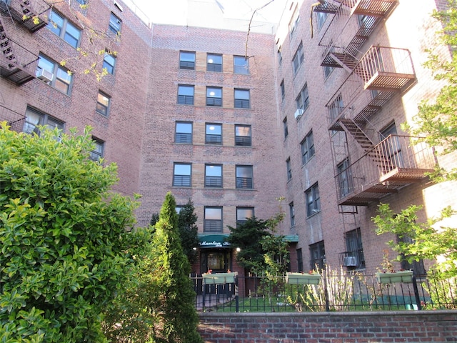 view of building exterior featuring fence