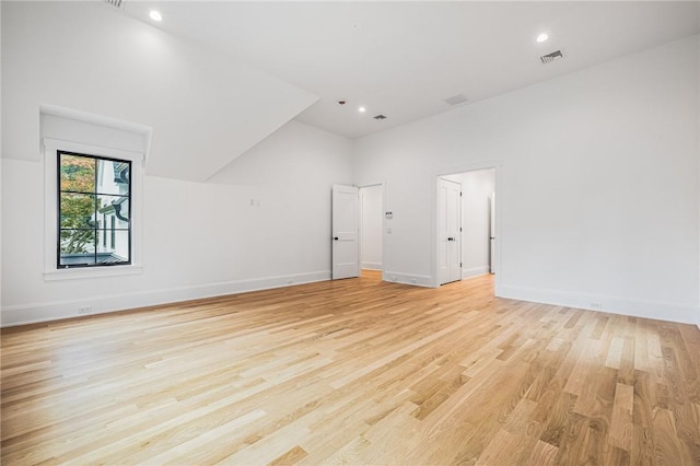 additional living space featuring visible vents, recessed lighting, light wood-style flooring, and baseboards