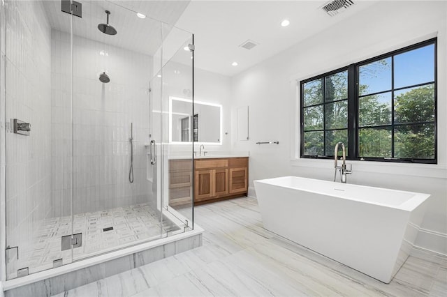 full bathroom featuring recessed lighting, vanity, visible vents, a soaking tub, and a stall shower