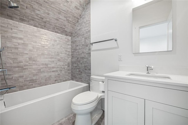 full bathroom featuring lofted ceiling, bathtub / shower combination, vanity, and toilet