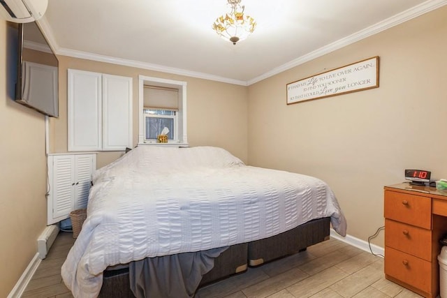 bedroom with ornamental molding and light hardwood / wood-style floors