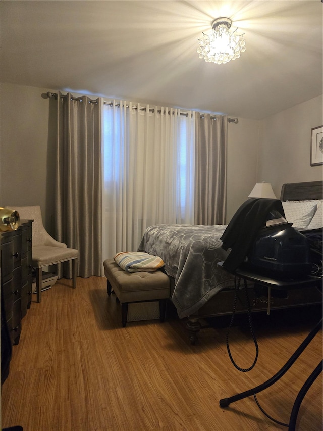 bedroom with wood-type flooring