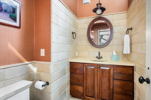 bathroom with toilet and vanity