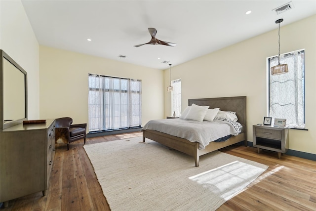 bedroom featuring visible vents, recessed lighting, a ceiling fan, and wood-type flooring