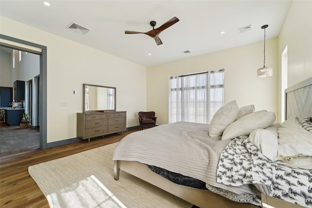 bedroom featuring visible vents, recessed lighting, and wood finished floors