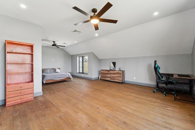 bedroom featuring light wood-type flooring, lofted ceiling, baseboards, visible vents, and recessed lighting
