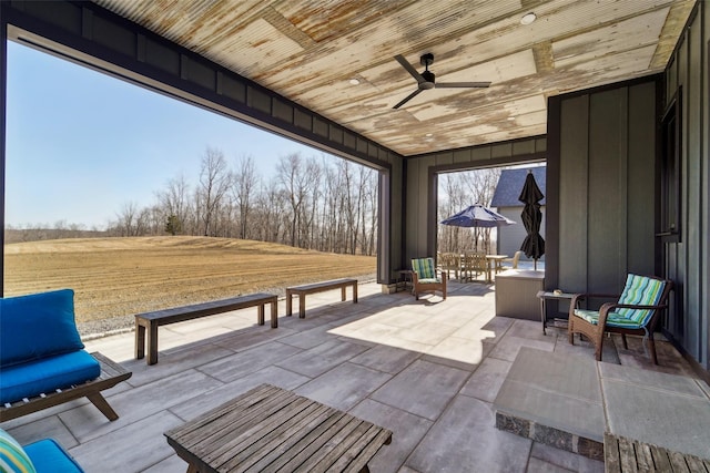 view of patio / terrace featuring ceiling fan