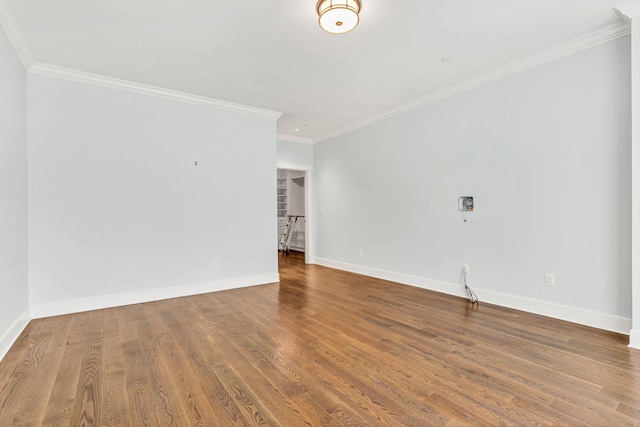 unfurnished room with hardwood / wood-style flooring and ornamental molding