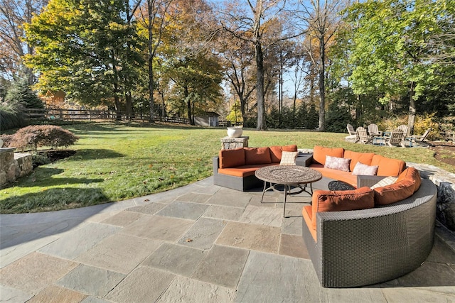 view of patio featuring fence and an outdoor living space