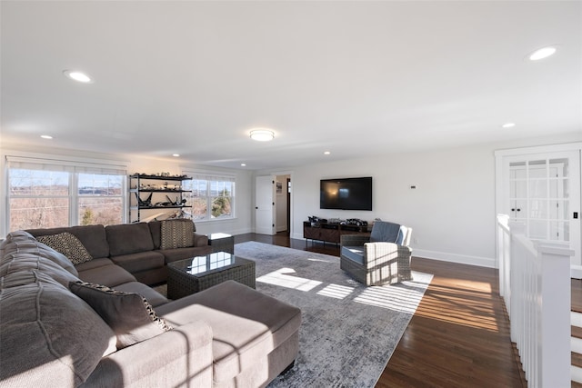 living area with recessed lighting, dark wood finished floors, and baseboards