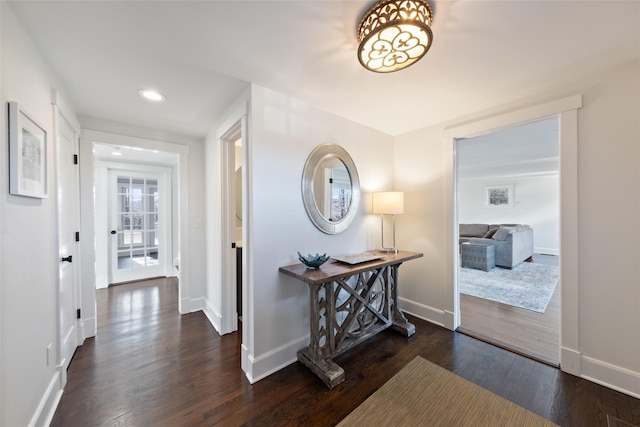 hallway featuring recessed lighting, baseboards, and wood finished floors