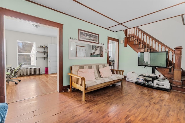 living room featuring radiator heating unit and wood-type flooring