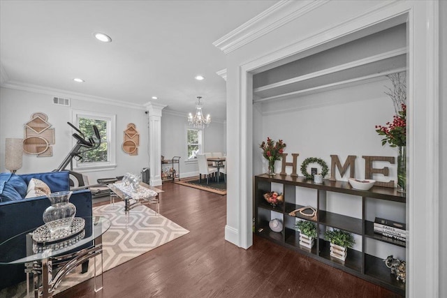 interior space with a wealth of natural light, ornamental molding, dark wood-style flooring, and visible vents