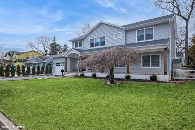 view of front of property featuring aphalt driveway, a front lawn, a shingled roof, and fence