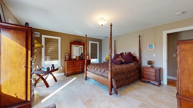 bedroom with visible vents and baseboards