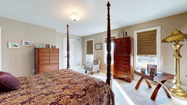 bedroom with visible vents and baseboards