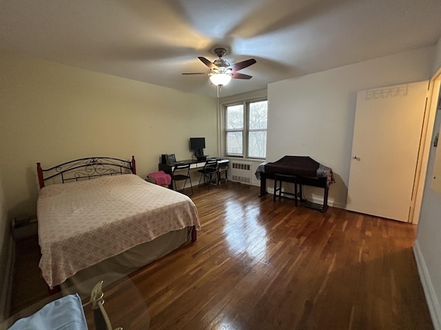 bedroom featuring ceiling fan, dark hardwood / wood-style floors, and radiator