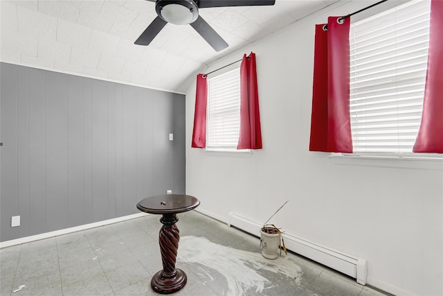 interior space with lofted ceiling, ceiling fan, and baseboards