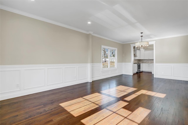 interior space featuring an inviting chandelier, crown molding, and dark wood-type flooring