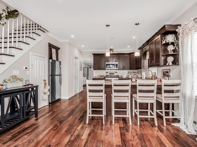 kitchen with dark brown cabinetry, hanging light fixtures, appliances with stainless steel finishes, dark wood-style floors, and open shelves