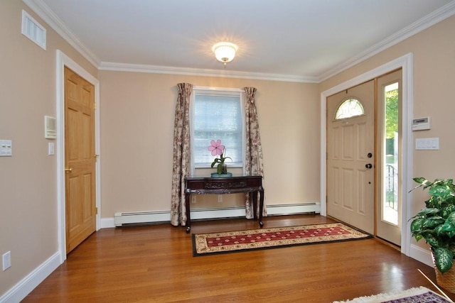 foyer featuring a healthy amount of sunlight, wood-type flooring, and ornamental molding