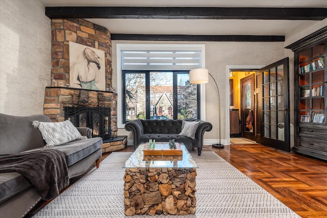 living room featuring parquet flooring, beam ceiling, and a fireplace