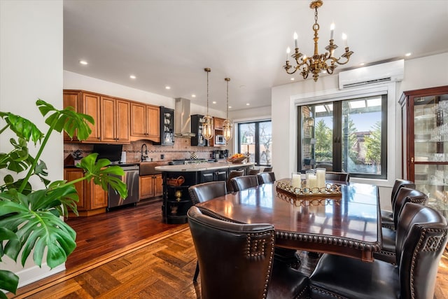 dining area featuring dark parquet floors, sink, a wall mounted AC, a notable chandelier, and french doors